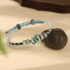 Adjustable Blue & White Handwoven Bracelet with Traditional "Peace Knot", Luck & Protection Jewelry for Women